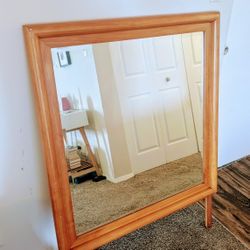 Mid-Century Modern Blond Oak Wood Mirror with beveled glass.