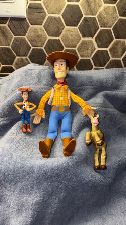 Disney’s Toy story Woody and bull’s-eye,  and taller, Woody