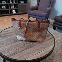 Coach 17"L x 10"H brown handbag.