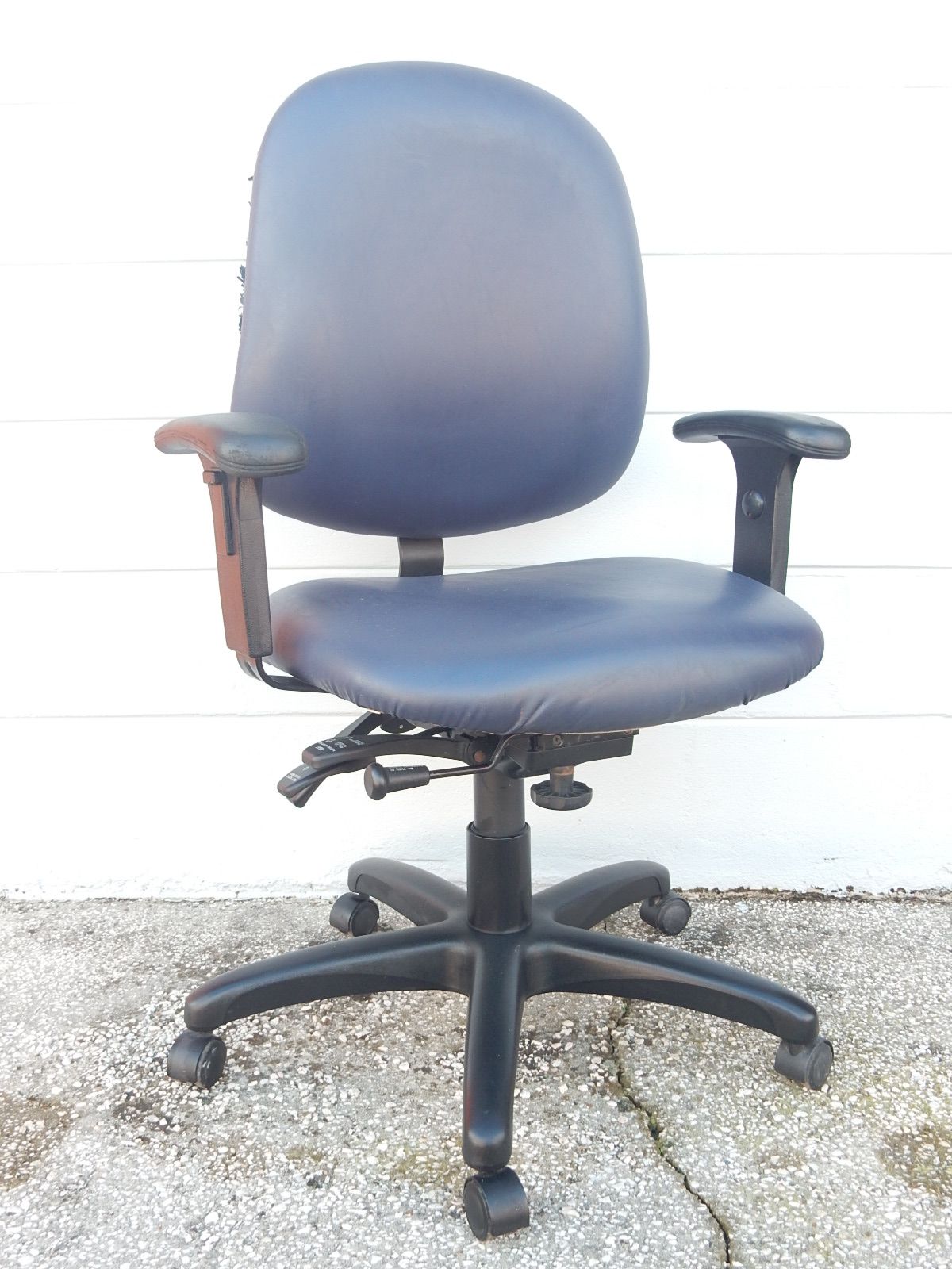 Blue high back office chair with several adjustments