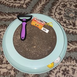 Gently Used Cat Scratcher With Ball, Cat Detangler, And Ramen Crinkly Toy 