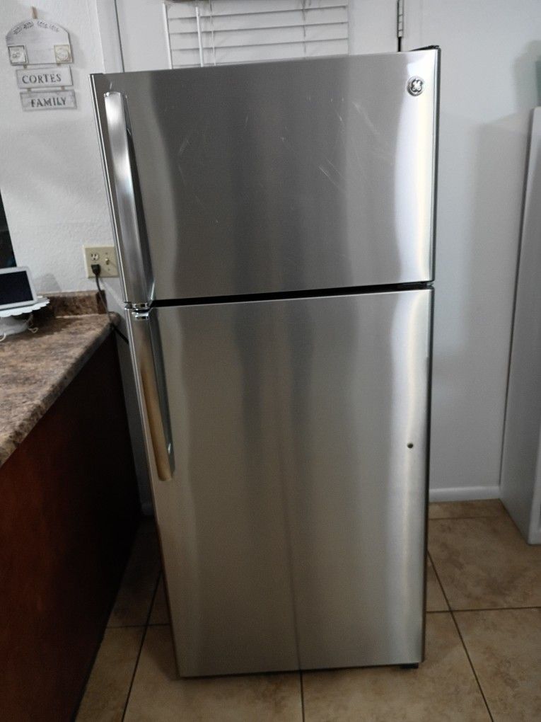 GE, STAINLESS STEEL REFRIGERATOR. wide28" deep 29" tall64"