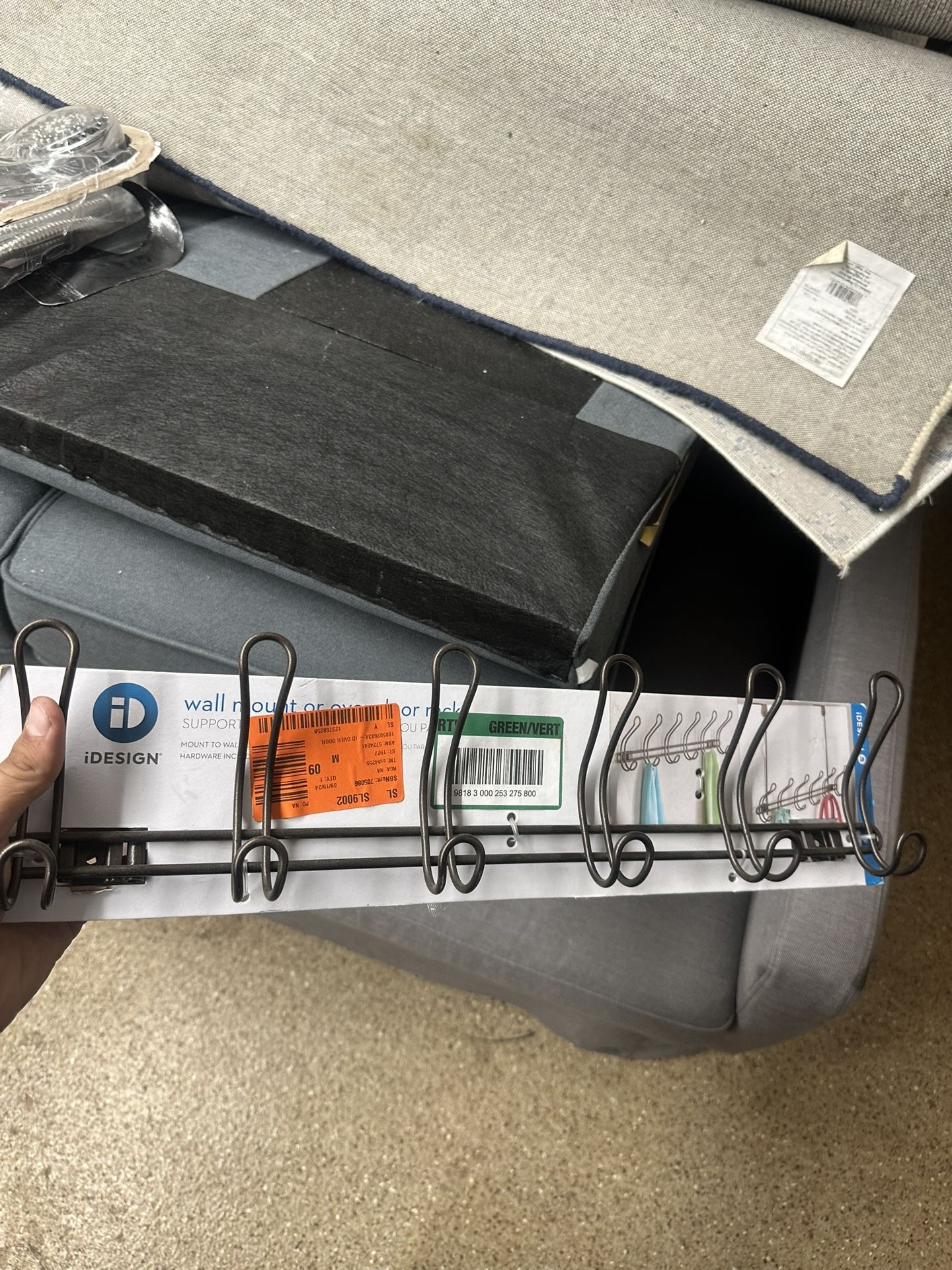 iDesign (formerly InterDesign) Classico or Mainstays over-the-door 6-hook rack. It is a metal rack designed for hanging items like coats, towels, robe