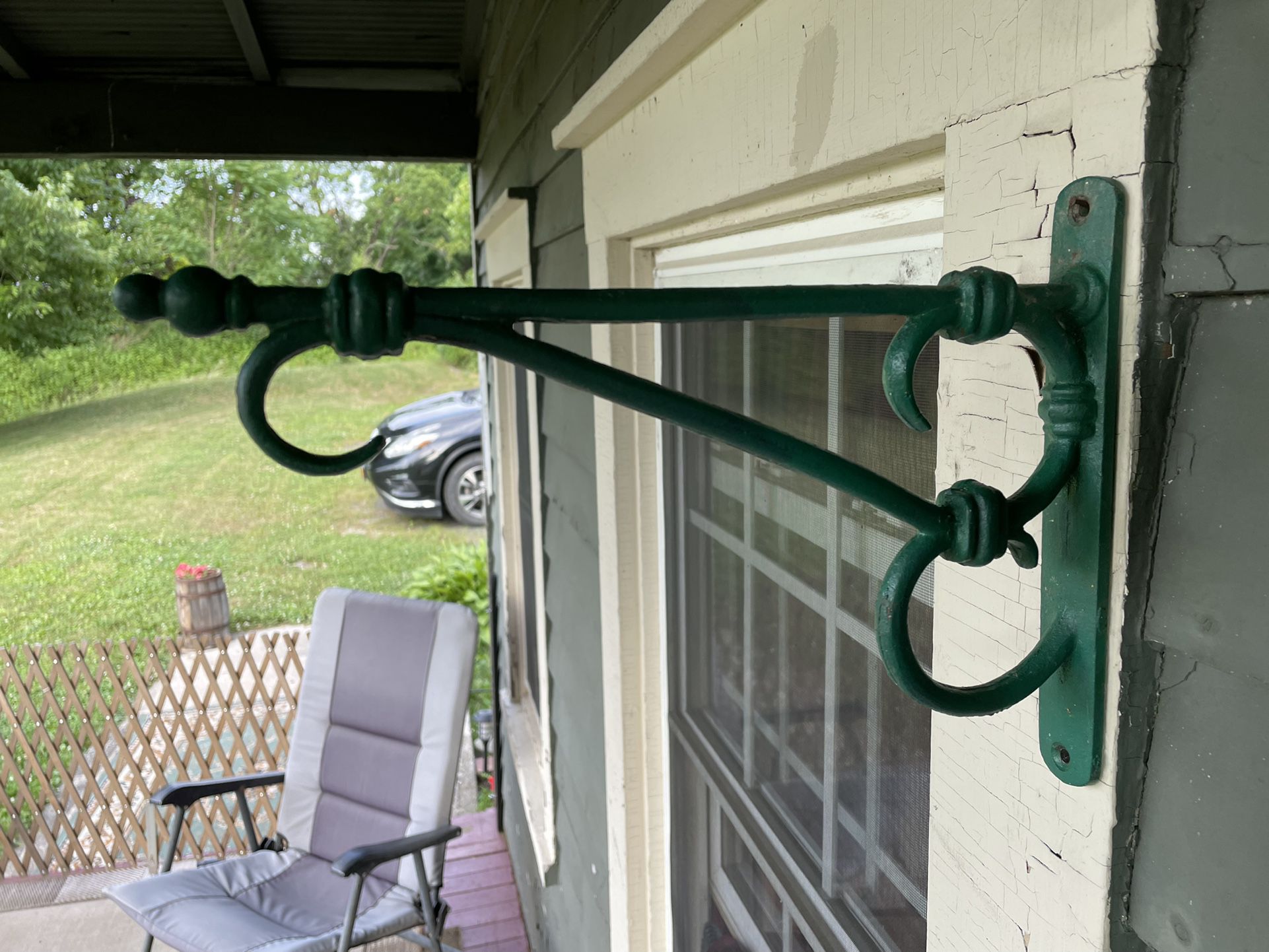 Outdoor sturdy metal plant/sign holder with scrollwork