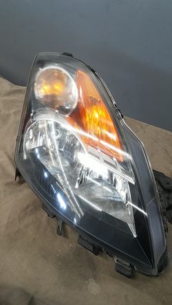 07 altima 4 door right side front head lamp
