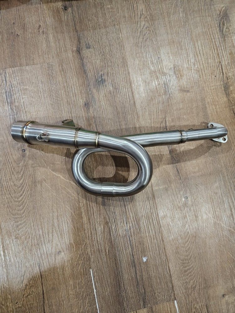 stainless steel full exhaust system header pipe designed for a Kawasaki Z125 Pro motorcycle