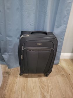 Samsonite large Black Luggage 4 wheels 360* around 50 pounds  Good Condition Everything Works