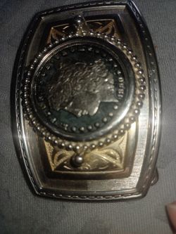 Silver dollar cutouts In belt buckle