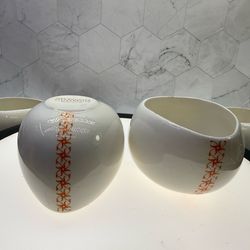 Set of (2) Chocolate Hug Mugs by Max Brenner. Mugs shaped to be held in both hands for the ultimate hot chocolate drinking experience! Holds 10oz. Cer