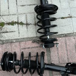 Struts With Coil Springs