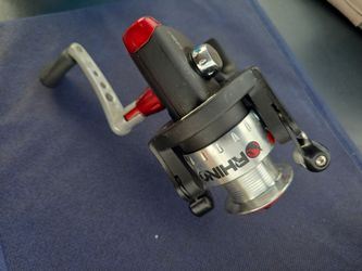 black and silver Rhino spinning fishing reel with red accents