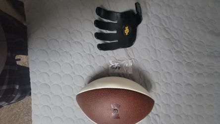 It grabs football holder