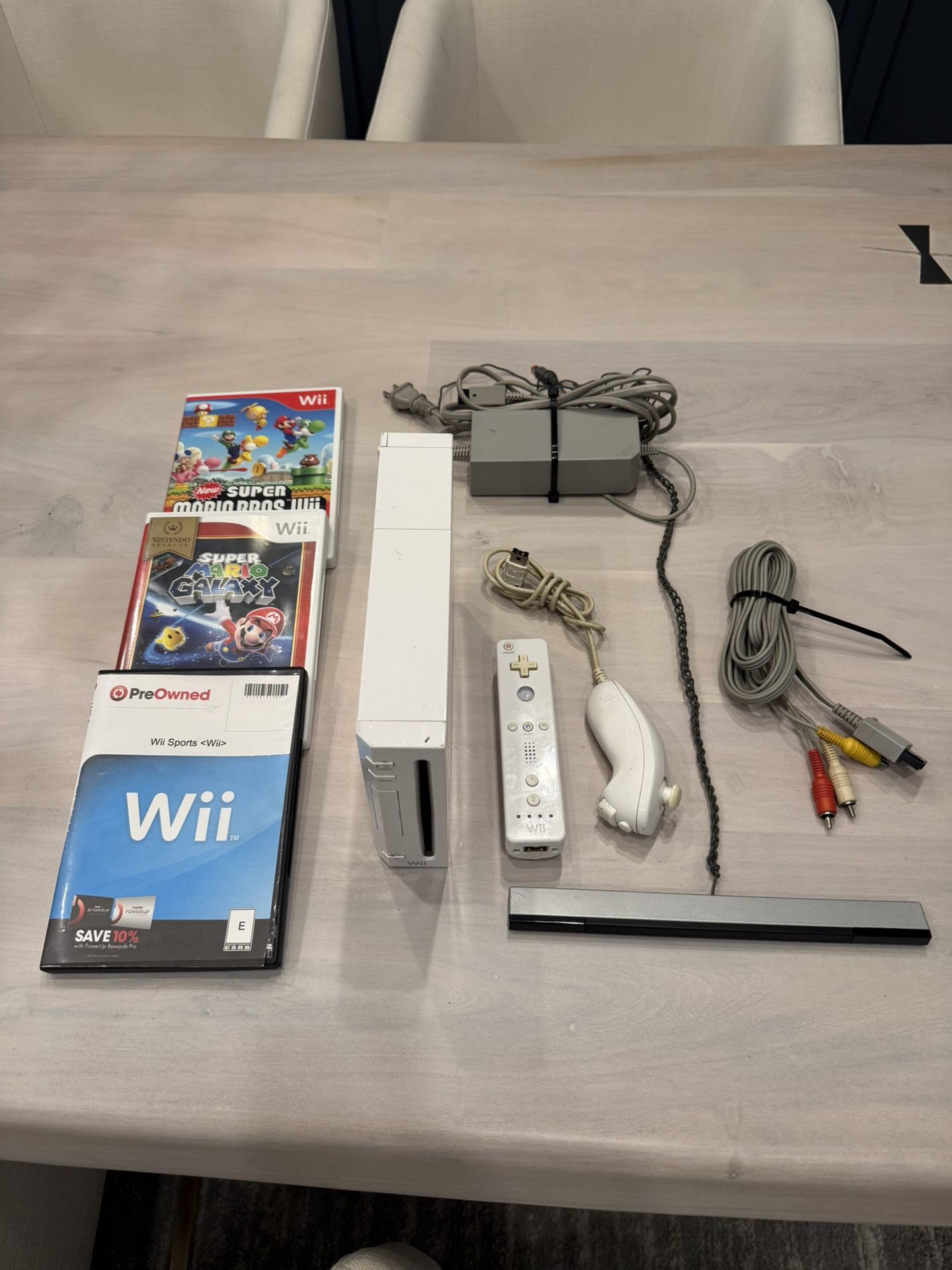 Nintendo Wii Bundle – Console, Remote, Sensor, Cables + 3 Games (Wii Sports, Mario Galaxy, New Super Mario Bros)
