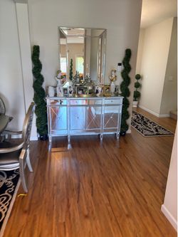 Mirrored entry table good condition and mirror decorations included