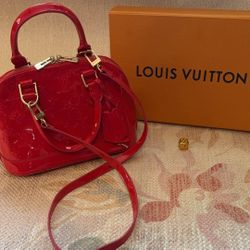 Red Louis Vuitton handbag