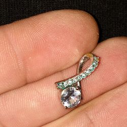 Sterling Silver Light Blue Topaz And Mosisnite Pendant 