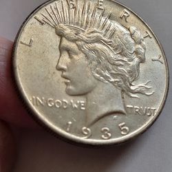 Authentic 1935 U.S. PEACE SILVER DOLLAR in NICE CONDITION