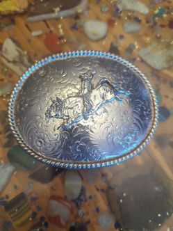 This vintage-style, silver-plated buckle
