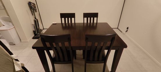 Dark Wood Dining Table with 4 Chairs and bench to seat 6 with hidden extra leaf