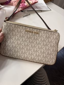white MK zip wrist bag