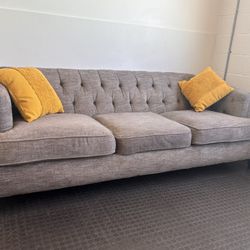  Jerome’s grey fabric sofa with tufted backrest