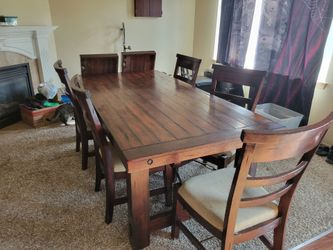 Solid wood table with five chairs and 2 leaves