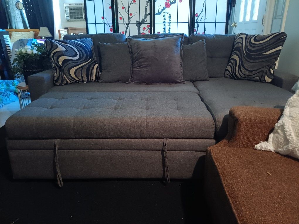 Small Grey Sectional With Storage And Turns Into Bed