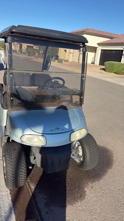 Blue Golf Cart with Windshield and Roof
