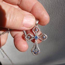 Tanzanite And White Zircon Cross Pendant. Rhodium Over Sterling Silver. 20 To 22" Chain.