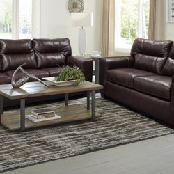 Leather sofa And loveseat in a rich chocolate color 