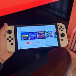 Nintendo Switch OLED with digital games.