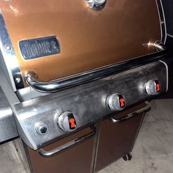 weber genesis orange bronze colored propane bbq grill 