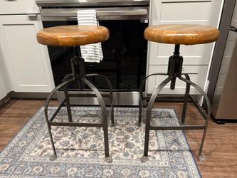 World Market Wood Adjustable Swivel Barstool Set Of Two; 2” ft for standard use at its lowest use and it goes as high as 2 ft  6 inches