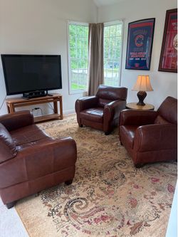 Leather loveseat and two matching chairs