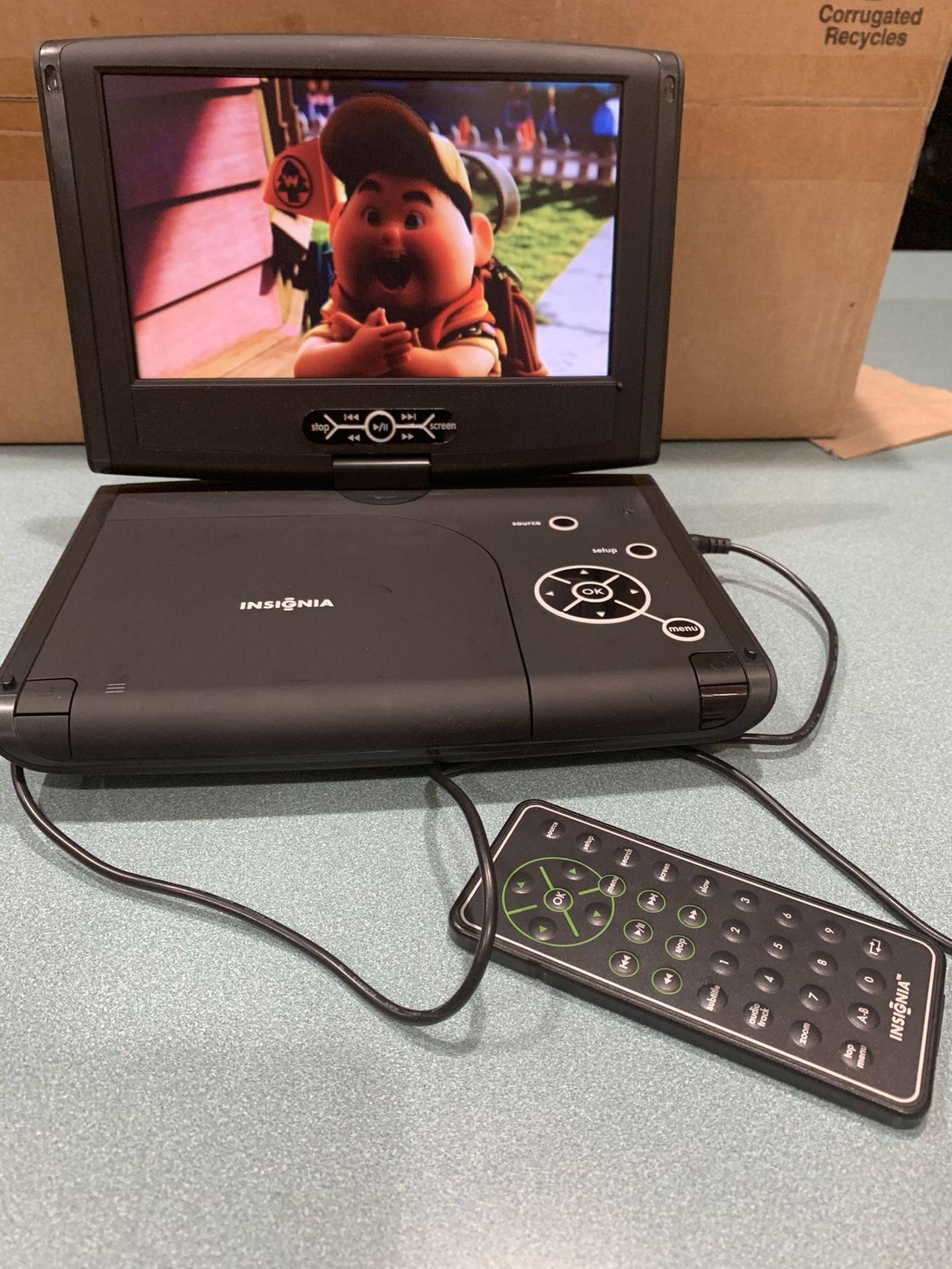 Insignia portable DVD player and 50 dvds