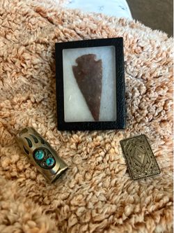 Silver belt, buckle, silver lighter case and a stone arrow I don’t know exactly what type of stone selling all three pieces for $140