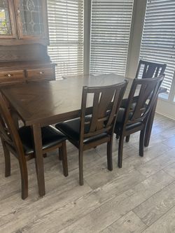 Dining room table like new four chairs and two person bench