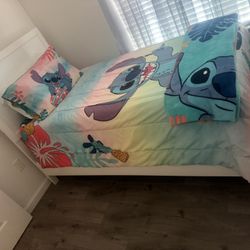 TWO TWIN BEDS BRAND NEW IN PLASTIC WITH BED FRAME AND HEAD BOARD AND NIGHT STANDS INCLUDED!