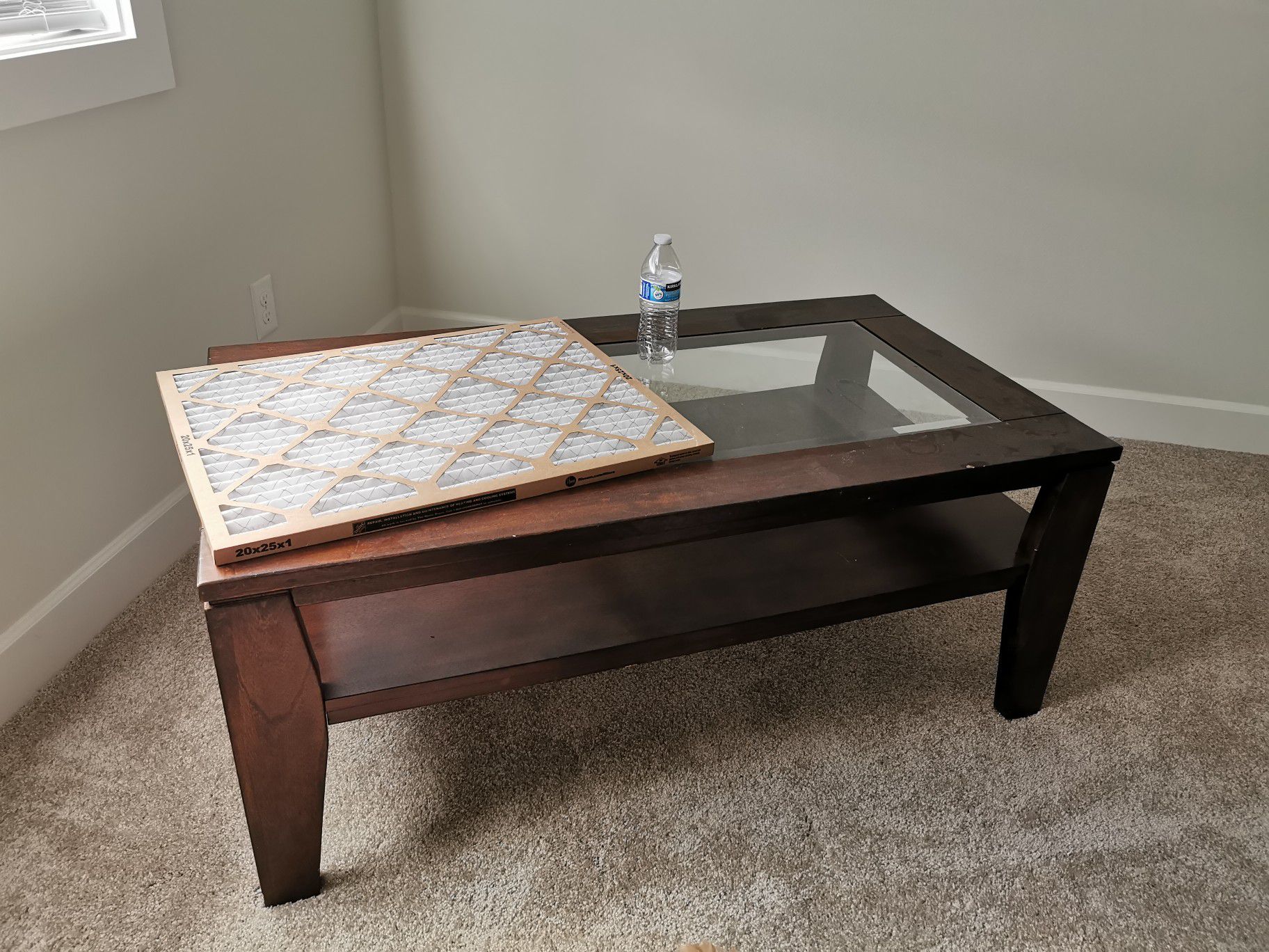 solid wood coffee table with glass