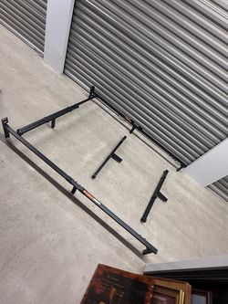 adjustable metal bed frame, which is a modular steel support base designed to fit multiple mattress sizes such as twin, full, queen, or king.