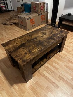 Coffee table with raised top