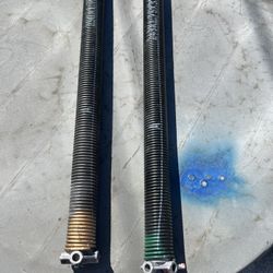Double garage door springs in good condition, each spring measures 34 1/2 inches.