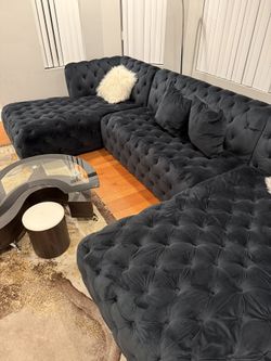 Stunning contemporary coffee table from rental property. Excellent condition! Features: ∙ Unique S-shaped tempered glass top ∙ Dark wood/espresso fi