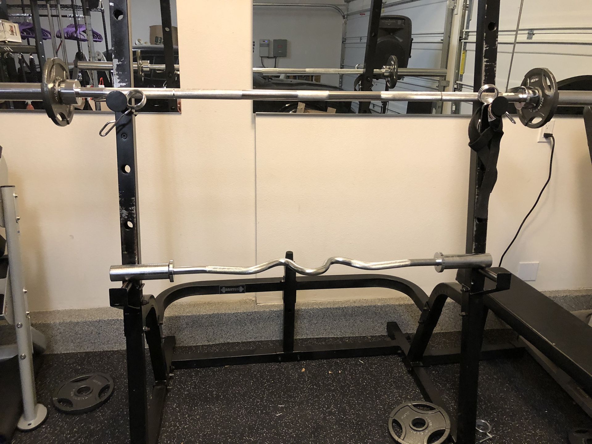 Olympic bar & Ez curl bar w/ weights Squat rack