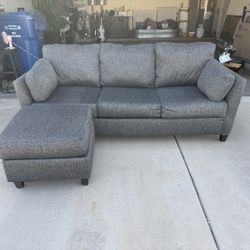 Grey couch with ottoman
