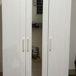 white wardrobe closet with mirror