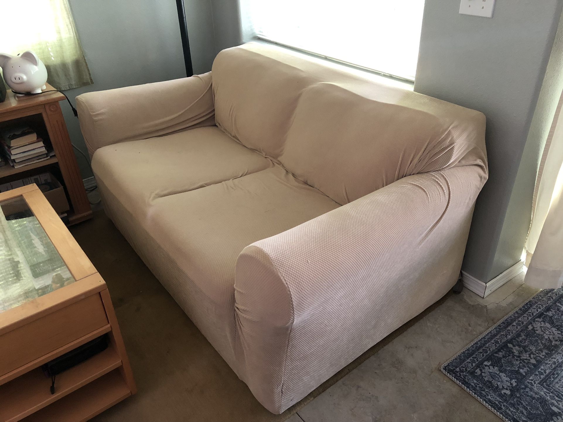 White Loveseat with Two Couch Covers