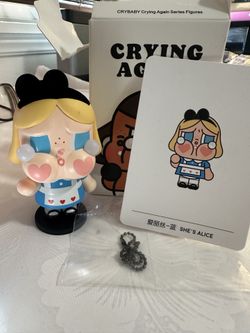 The Pop MART Crybaby Crying Again Series Figurines Love is Love is a 5-inch PVC action figure featuring the character Crybaby from the TV show "Crybab
