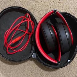 black/red Beats headphones 