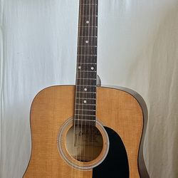 Carlo Robelli Acoustic Guitar Full Size Dreadnought. Plays and sounds great. Low action. Easy playing. No case.